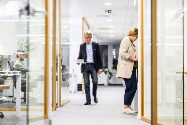 istock Businessman walking in office 2037212333