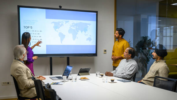 istock Businesswoman giving presentation with graph 2037212519