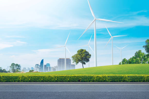 Clean roads and wind energy: renewable energy. EV Charger station. Environmentally responsible logistics industry with clean energy. Wind turbines generate electricity in vast fields. intelligent city carreteras limpias y energía eólica: energías renovables. estación de carga de vehículos eléctricos. industria logística responsable con el medio ambiente y energía limpia. las turbinas eólicas generan electricidad en vastos campos. ciudad intelig