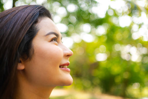 istock Optimistic Woman Smiling Towards the Sky 2037255049