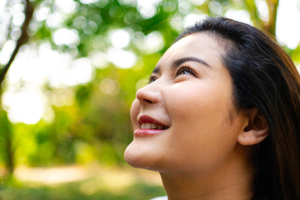 istock Optimistic Woman Smiling and Looking Upward 2037255055