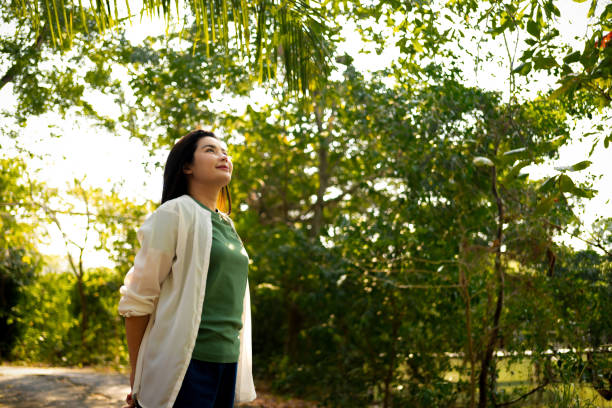 istock Dreamy Woman Enjoying Peaceful Forest Ambiance 2037255063