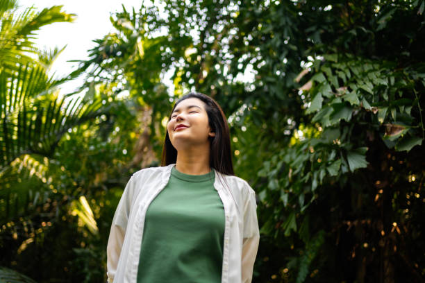 istock Contemplative Woman Amidst Tropical Foliage 2037255569