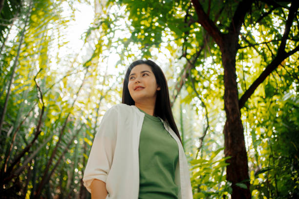 Dreamy Woman Enjoying Peaceful Forest Ambiance