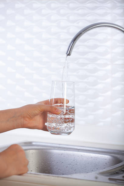 istock Filling glass of water from the tap, safe drinking 2037280815