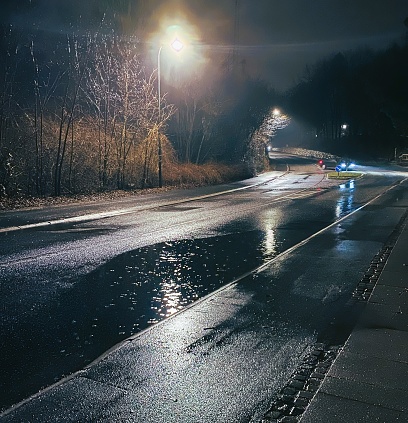 Flooding on the Copenhagen suburb road caused by heavy rain compounded by a blocked sewer