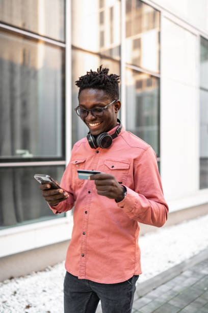 istock Young man making online purchases on smartphone 2037331074