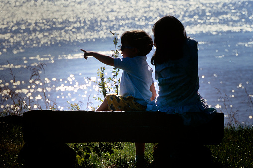 childrens observing the boat on the river on june 15/1999