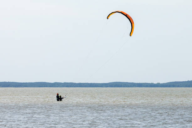 Kiteboarding in Squamish, British Columbia. Active male enjoying water sports. Adventure on the sea.