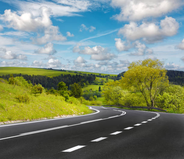 istock Asphalt road on a beautiful summer day 2037340511