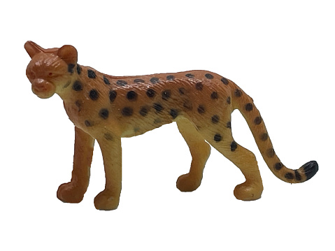 A leopard toy on a white background. Wild animal one leopard on a white background. Toy wildlife leopard