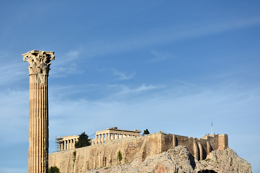 The Parthenon in the Acropolis of Athens and one of the columns of the Temple of Olympian Zeus, Greece