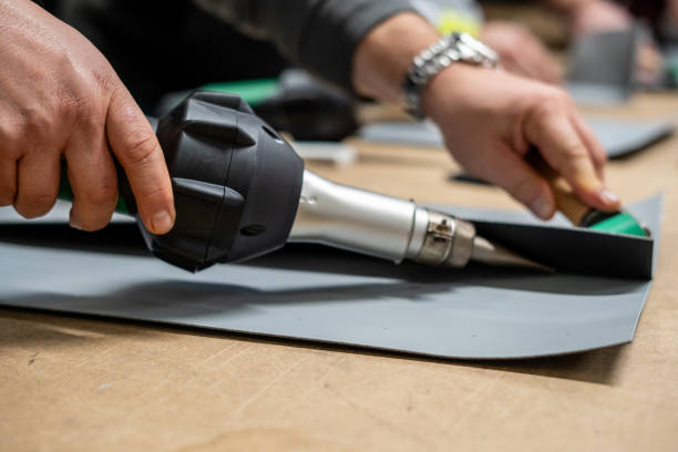 istock welding machine is in man hand for weld synthetic membrane horizontal close up still 2037365683