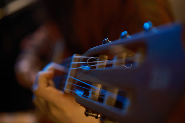 istock blue studio color light  close up professional classical guitar 2037377218