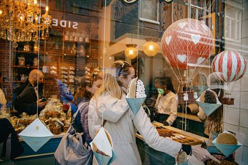 Street view of the Van Wonderen shop window of a famous and traditional Dutch Stroopwafels dessert shop in Amsterdam, Netherlands