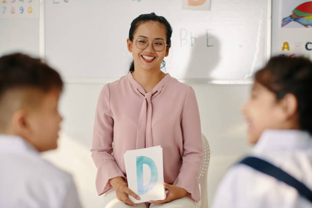 istock Proud Teacher Looking at Her Students 2037412292