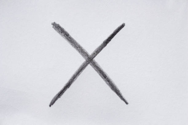 Charcoal hand drawn x sign on white paper. Clipping path.