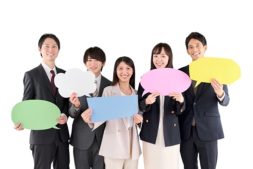 Business person with speech bubble on white background