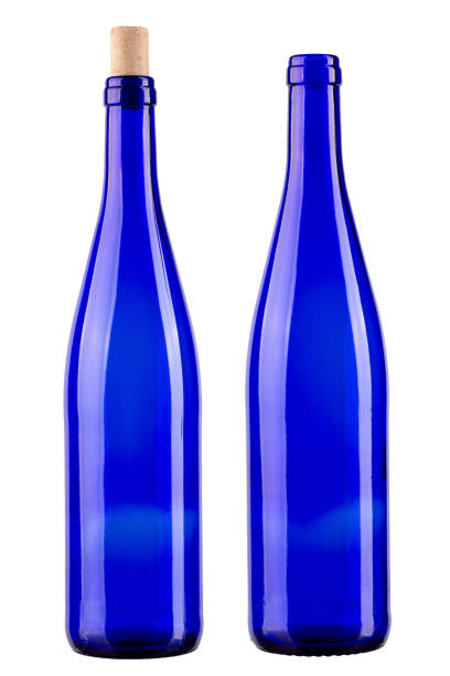 istock Two blue bottles, one with a cork, the other without isolated on white background. Vertically standing wine bottle. File contains clipping path. F 2037450121