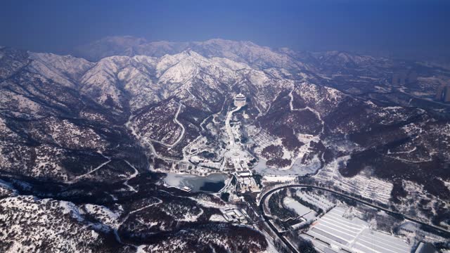 Aerial video of Xianguding in Weihai, Shandong, China after heavy snowfall in winter.