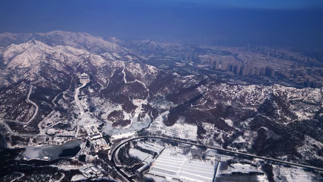Aerial video of Xianguding in Weihai, Shandong, China after heavy snowfall in winter.