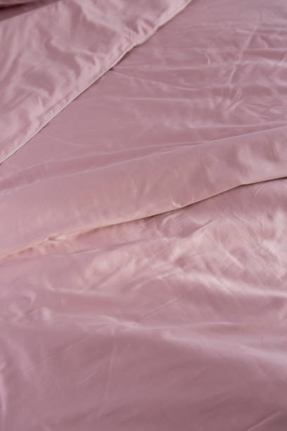 istock wrinkled pink cotton bed linen blanket 2037557902