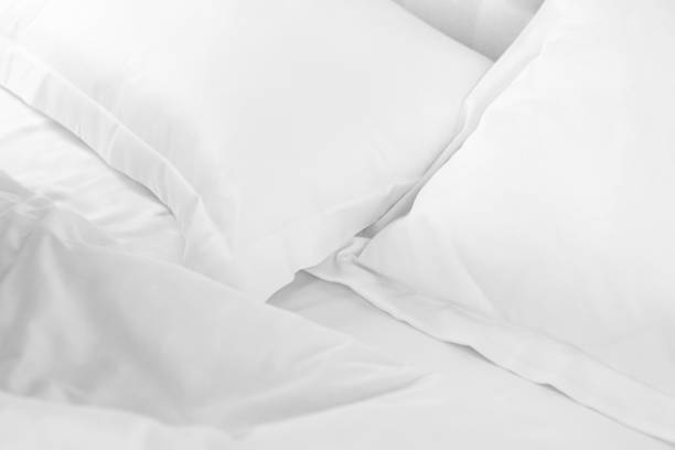 istock Whte cotton bed linen blanket and pillows 2037557904