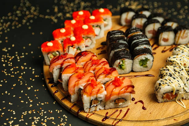 istock Assorted Sushi on Wooden Plate 2037565877