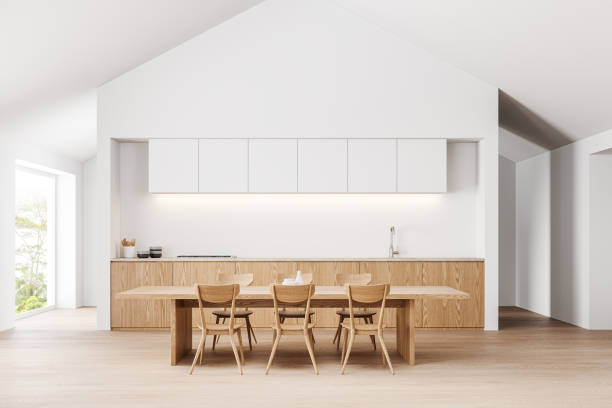 istock Stylish home kitchen interior with eating table and seats, panoramic window 2037566931