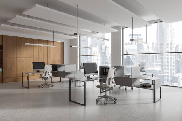 istock Stylish office interior with desk and shelf, workplace near panoramic window 2037578319