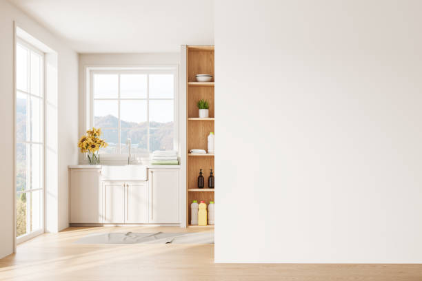 istock Stylish home laundry room interior with accessories and window. Mockup wall 2037578533