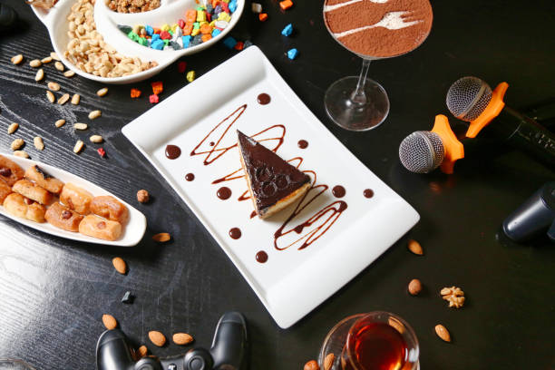A table filled with plates of food and drinks, showcasing a diverse array of culinary delights.