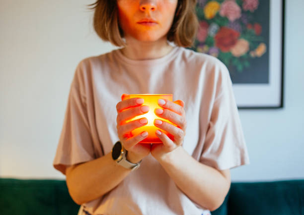 istock Woman holding lighted candle 2037594831