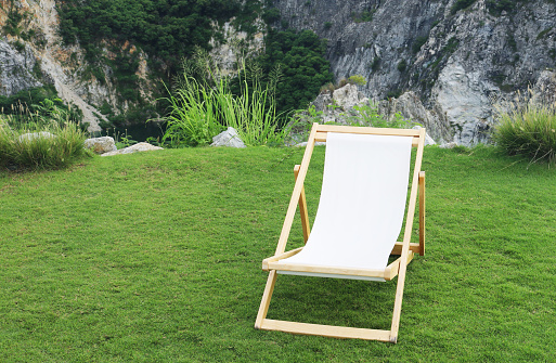 Garden deck chair on the lawn.