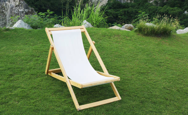 istock Empty garden deck chair on the lawn. 2037606308