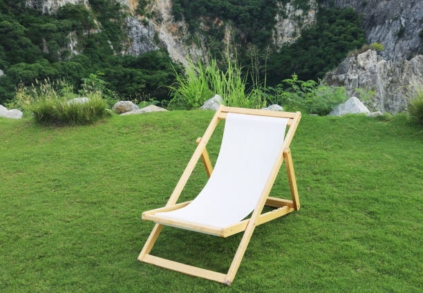 istock Garden deck chair on grass field. 2037606820