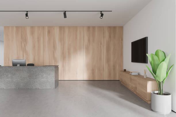 istock Stylish modern office reception interior stone desk and sideboard with tv screen 2037607365
