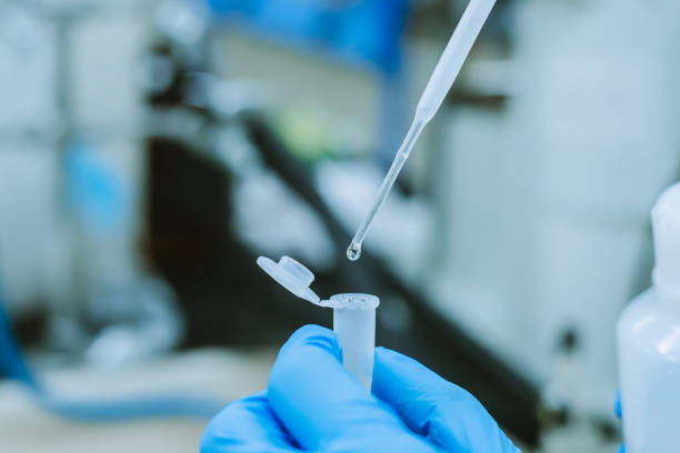 istock Scientist Transferring Liquid Sample into Eppendorf Tube with Micropipette 2037612159