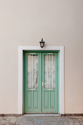 Cycladic door in mint green on Santorini island, Cyclades, Greece