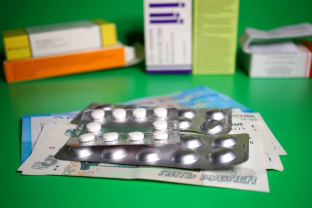 A package with pills and paper bills on the table. Medicine and medicines.