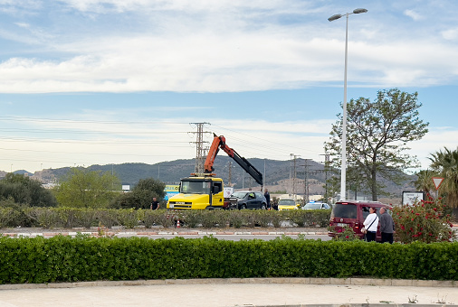 Recovery Truck Tows a car after crash. SCANIA Emergency Rescue Wrecker Tow Truck coach car. Towing Vehicle. ars accident on freeway. Auto Car wreck on road. August 12, 2023, Spain, Sagunto