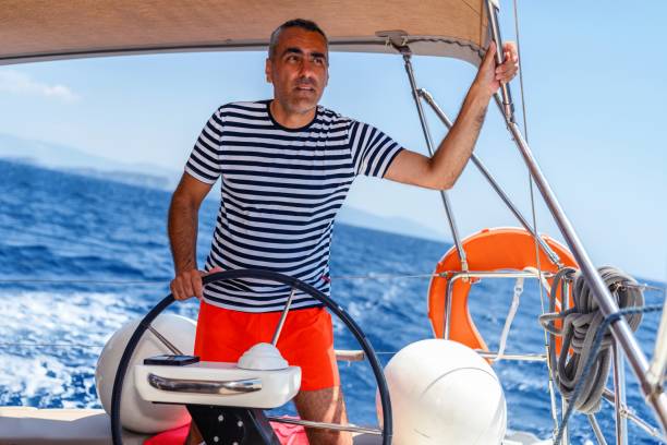 Sailor skipper manages sailing vessel