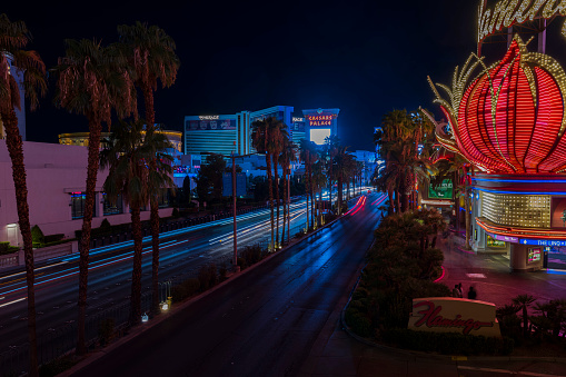 Las Vegas. USA. 09.25.2023. Night view of the Las Vegas cityscape, showcasing captivating blurred light trails from cars along the iconic Strip Road.