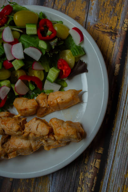 chicken souvlaki and salad
