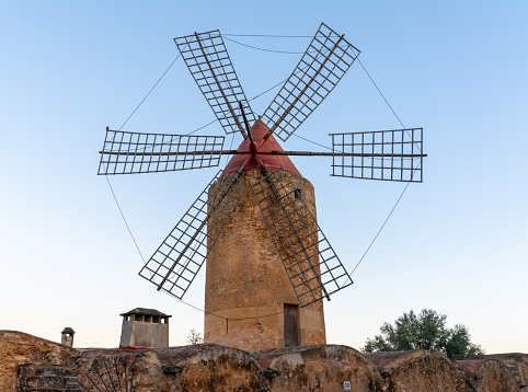 Algaida, Spain - 21 January, 2024: historic windmill in the country town of Algaida in the interior of Mallorca at sunrise