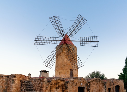 Algaida, Spain - 21 January, 2024: historic windmill in the country town of Algaida in the interior of Mallorca at sunrise