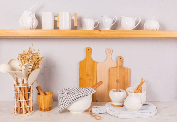 istock Front view of an open wooden shelf and kitchen countertop with eco-friendly kitchen utensils and a bouquet of ears of corn. Eco-friendly kitchen 2037767362