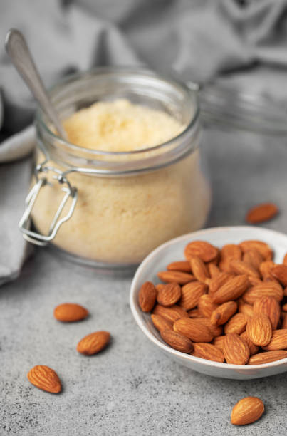 istock Fresh almond flour in a  glass jar and almonds 2037774418
