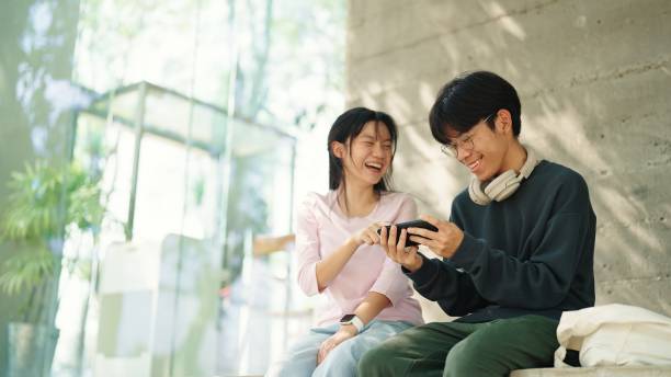 istock Teenager relaxing with smartphone together. 2037800572