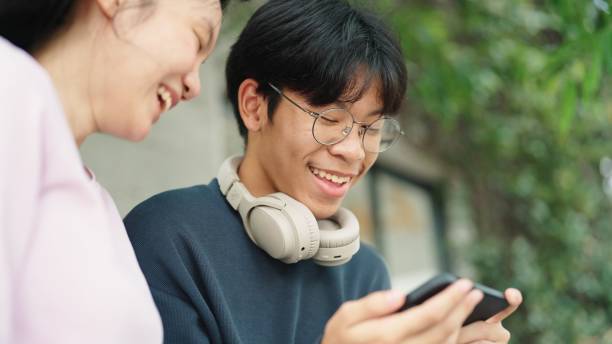 istock Teenager relaxing with smartphone together. 2037800580